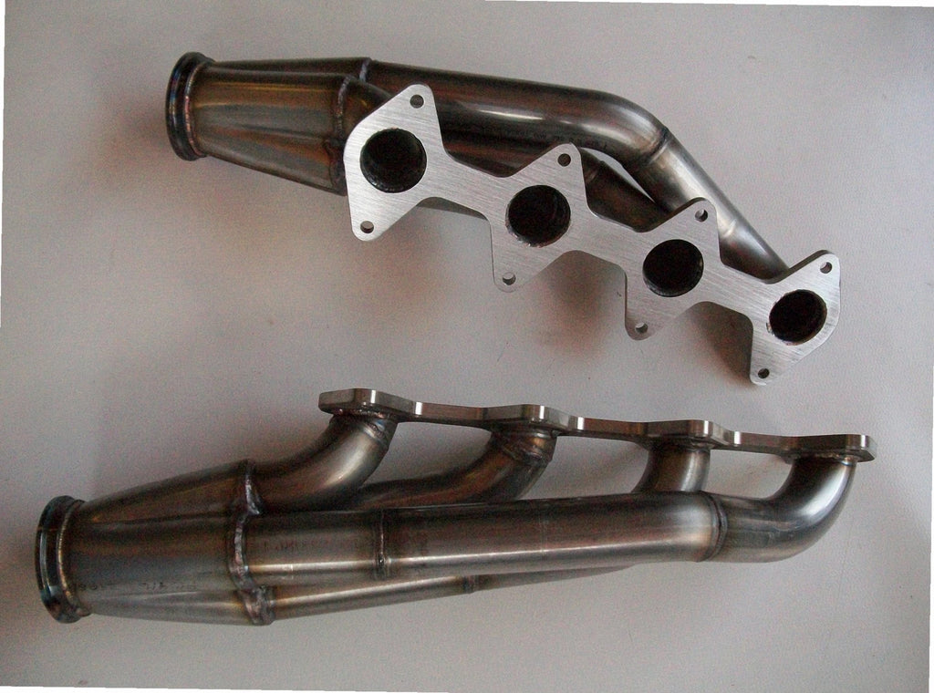 3 Valve Racing Turbo Headers — passenger-side header with V-band flange and merge collector