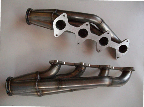 3 Valve Racing Turbo Headers — passenger-side header with V-band flange and merge collector