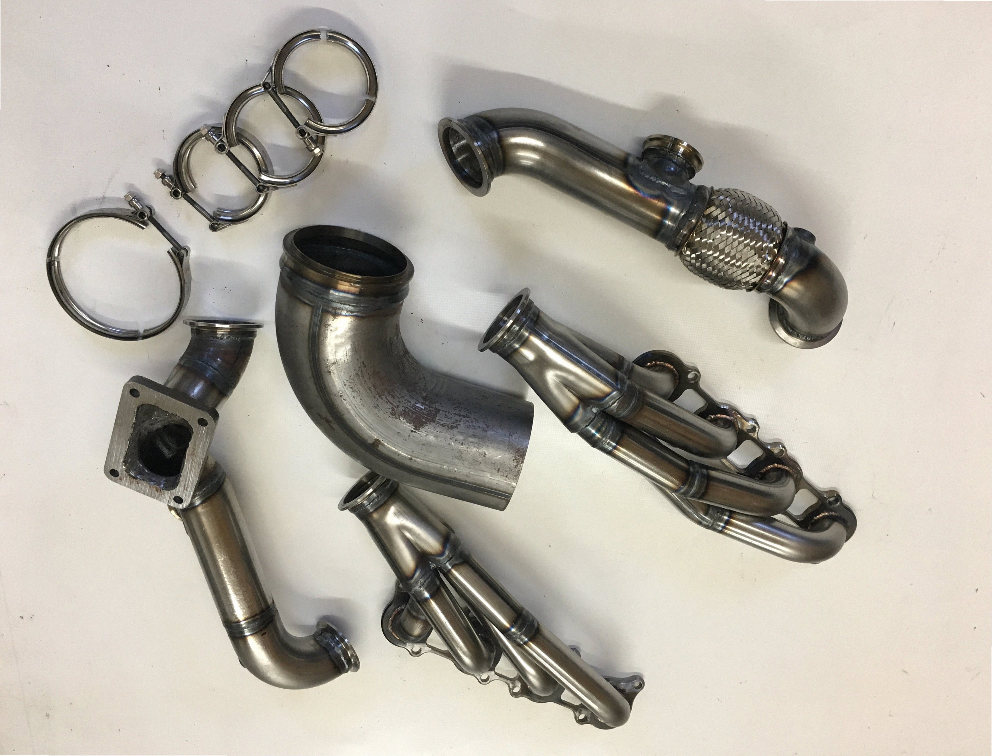5.0 Coyote 10-14 TO6 Turbo Race Kit — detail view of merge collector, flex bellow joint, and V-band connection