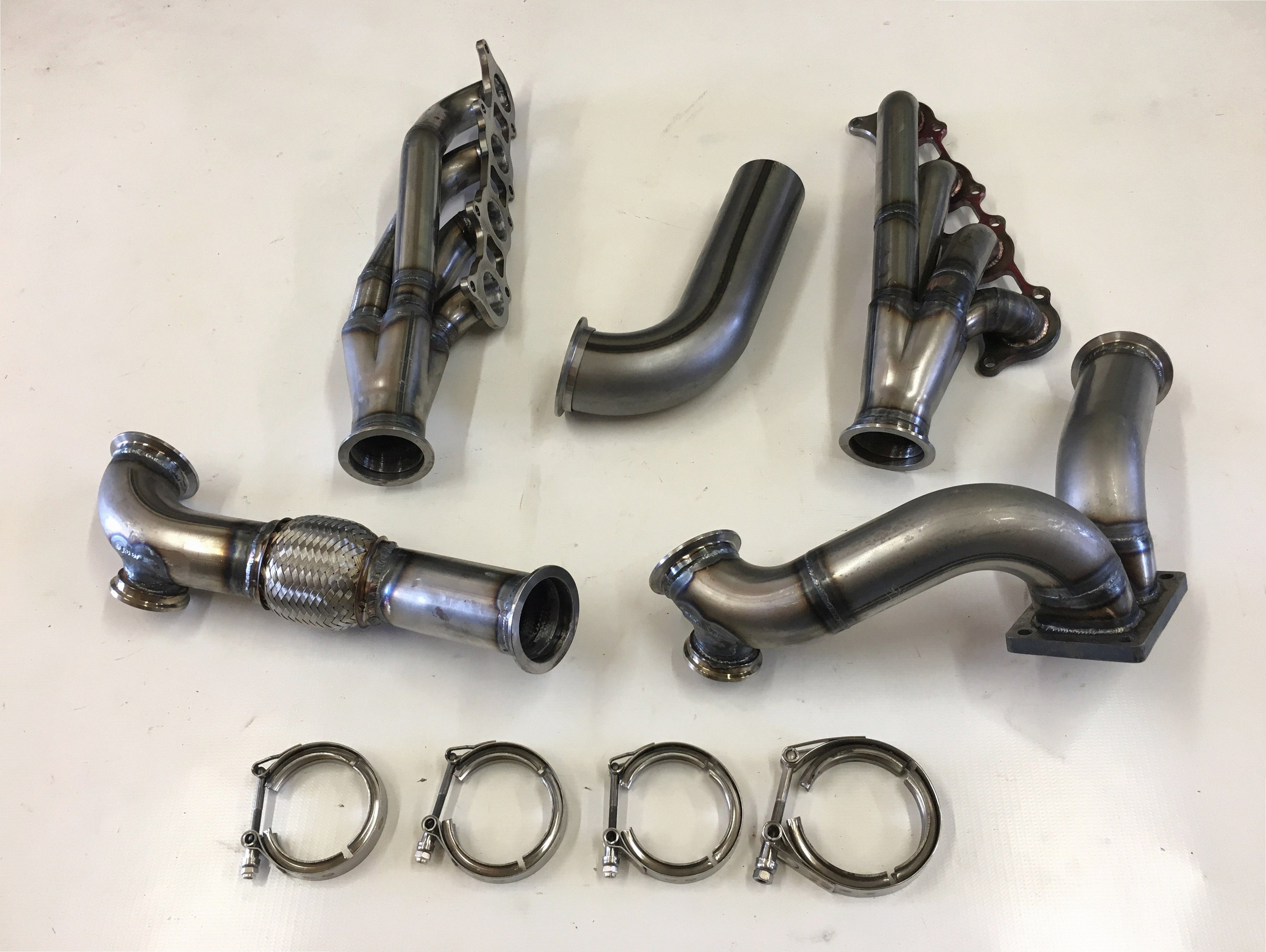 5.0 Coyote 15-18 TO4 Turbo Street/Drag Kit — passenger-side header with V-band flange and merge collector