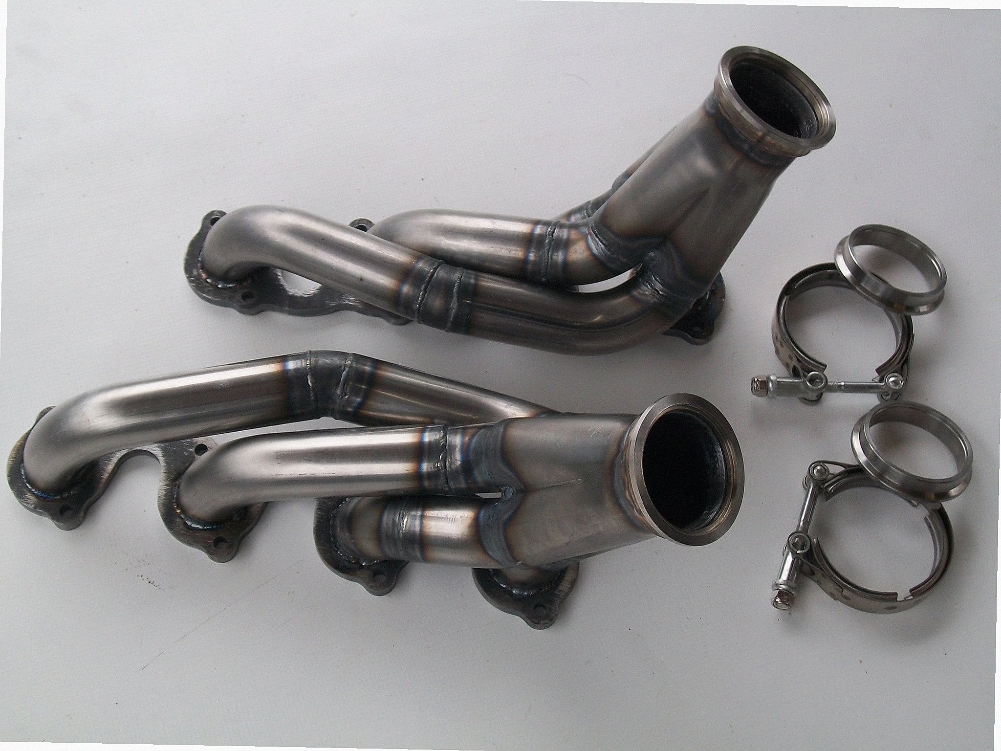 4.6 2V Turbo Headers A/C Delete — detail view of merge collector, flex bellow joint, and V-band connection